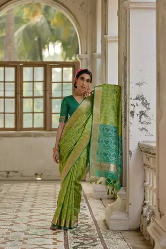 Green raw silk blend c wevon ikat ceremonial saree