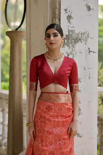 Rust raw silk blend c wevon ikat ceremonial saree