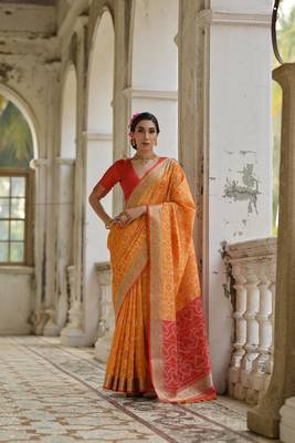 Mustard raw silk blend c wevon ikat ceremonial saree 1