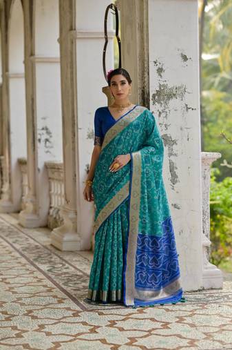 Teal raw silk blend c wevon ikat designer ceremonial saree