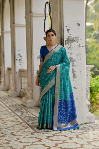 Teal raw silk blend c wevon ikat designer ceremonial saree