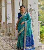 Teal raw silk blend c wevon ikat ceremonial saree