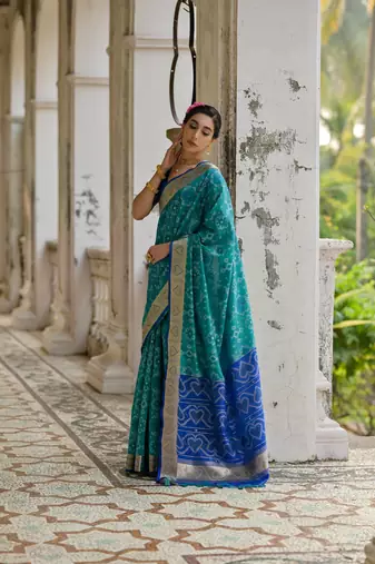 Teal raw silk blend c wevon ikat ceremonial saree