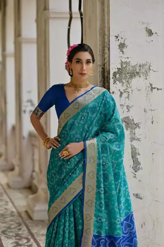 Teal raw silk blend c wevon ikat ceremonial saree