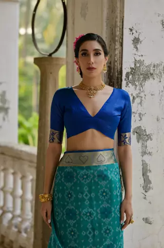 Teal raw silk blend c wevon ikat ceremonial saree