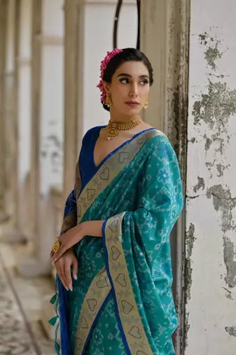 Teal raw silk blend c wevon ikat ceremonial saree