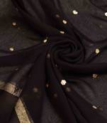 Elegant black georgette saree with golden accents