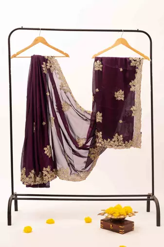 Purple embroidered chiffon saree.