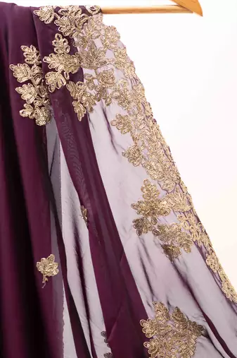 Purple embroidered chiffon saree.