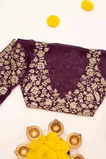 Purple embroidered chiffon saree.