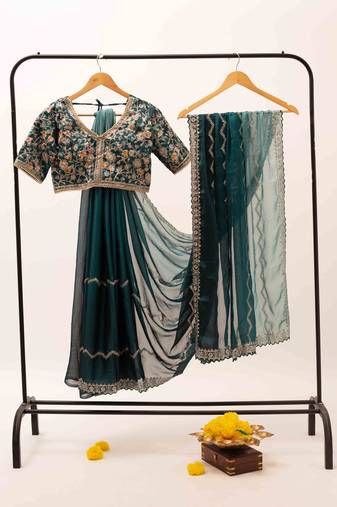 Elegant emerald embroidered saree with stitched heavy embroidered blouse