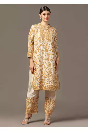 Mustard yellow parsi embroidered jaal kurta paired with pants and organza dupatta