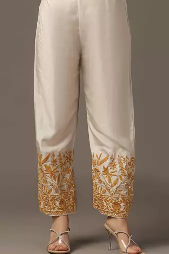 Mustard yellow parsi embroidered jaal kurta paired with pants and organza dupatta