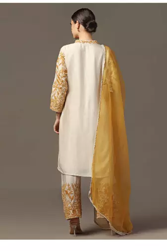 Mustard yellow parsi embroidered jaal kurta paired with pants and organza dupatta