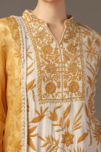Mustard yellow parsi embroidered jaal kurta paired with pants and organza dupatta