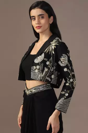 Black top with draped skirt and embroidered jacket