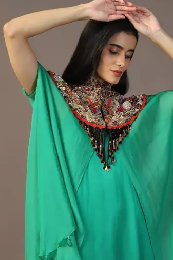 Leaf green gown with embroidered cape