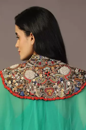 Leaf green gown with embroidered cape