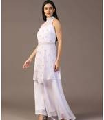 White peplum top with flared pant