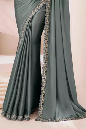 teal embroidered georgette saree with unstitched blouse piece