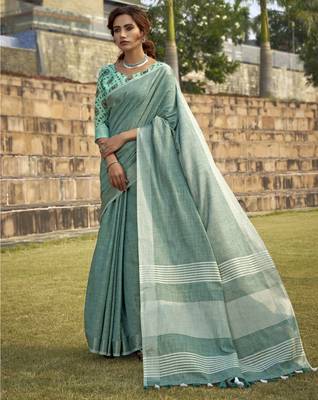 Turquoise linen blend saree with unstitched linen blouse piece 1
