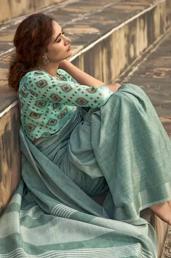 Turquoise linen blend saree with unstitched linen blouse piece