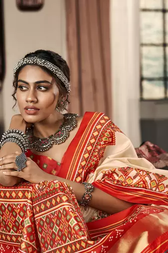 Beige patola silk blend saree with unstitched patola blouse piece