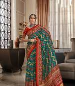 Teal-red patola silk blend saree with unstitched patola blouse piece