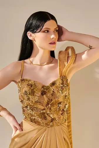 Golden hand embroidered drape gown with 3d hand embellished trail
