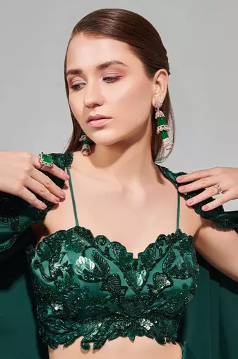 Emerald green hand embroidered cape set with cutwork blouse and drape skirt