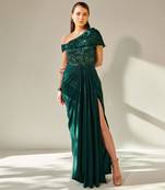 Off shoulder emerald green drape gown with waist cut out