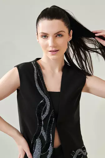Black draped gown with voluminous sleeves
