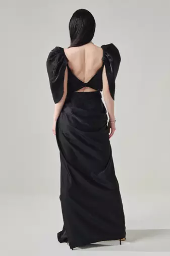 Black draped gown with voluminous sleeves