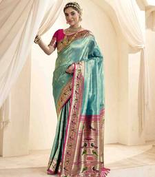 Turquoise tissue silk blend saree with unstitched tissue blouse piece