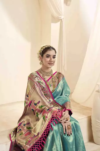 Turquoise tissue silk blend saree with unstitched tissue blouse piece