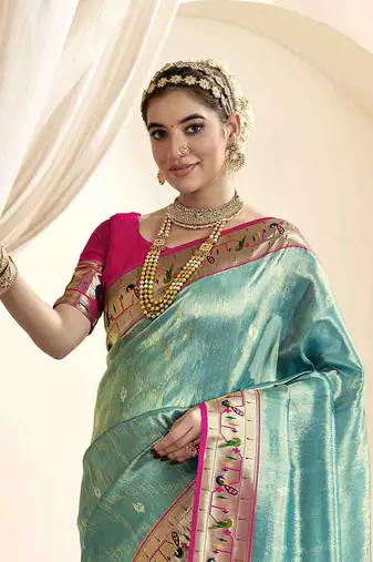 Turquoise tissue silk blend saree with unstitched tissue blouse piece