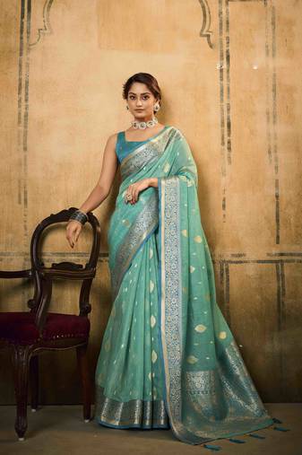 Turquoise tissue silk blend saree with unstitched tissue blouse piece
