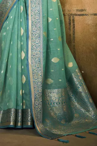 Turquoise tissue silk blend saree with unstitched tissue blouse piece