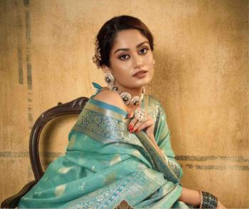 Turquoise tissue silk blend saree with unstitched tissue blouse piece 4