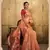 Peach tissue silk blend saree with unstitched tissue blouse piece