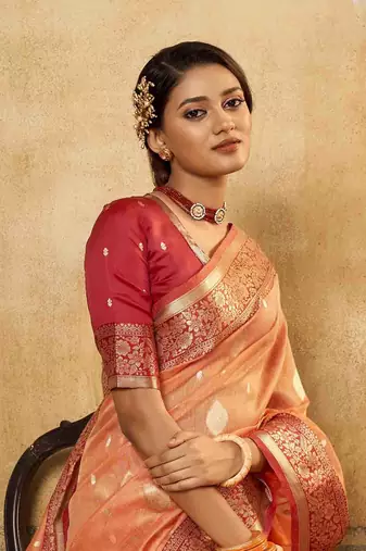 Peach tissue silk blend saree with unstitched tissue blouse piece