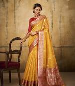 Yellow tissue silk blend saree with unstitched tissue blouse piece