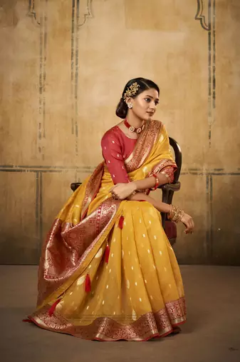 Yellow tissue silk blend saree with unstitched tissue blouse piece