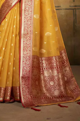 Yellow tissue silk blend saree with unstitched tissue blouse piece