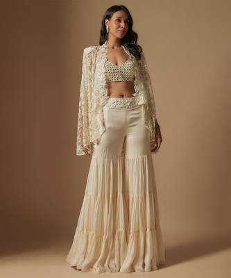 Orlique mirror work blouse paired with embroidered cape and sharara 1