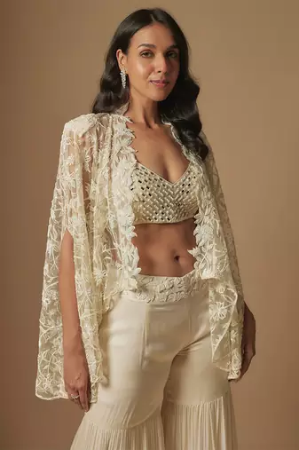 Orlique mirror work blouse paired with embroidered cape and sharara