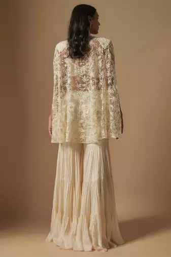 Orlique mirror work blouse paired with embroidered cape and sharara