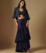 Marasu mirror work blouse paired with hand embroidered cape and ruffled skirt