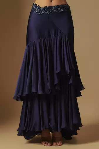 Marasu mirror work blouse paired with hand embroidered cape and ruffled skirt