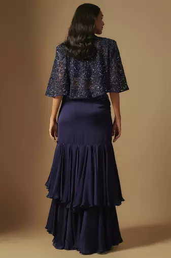 Marasu mirror work blouse paired with hand embroidered cape and ruffled skirt